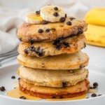 air fryer pancakes stacked on a white plate
