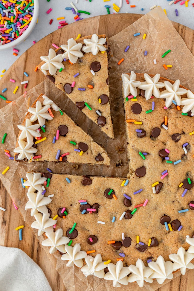 air fryer cookie cake with two pieces sliced