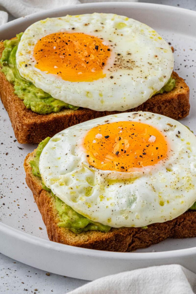 two air fryer fried eggs on avocado toast