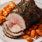 air fryer brisket on a plate with roasted carrots