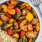 air fryer cajun chicken and peppers on a plate with brown rice