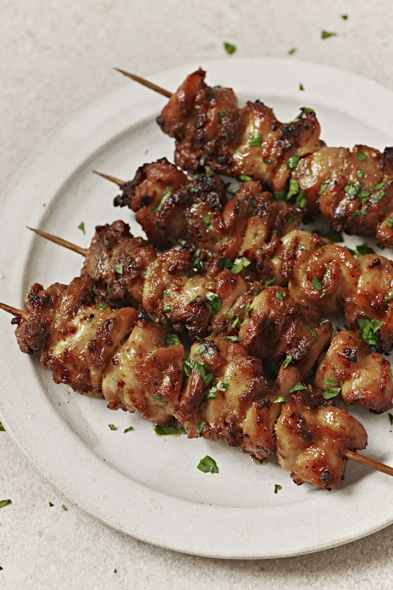 air fryer chicken skewers on a white plate