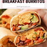 Air fryer breakfast burritos packed with scrambled eggs, veggies, and avocado, sliced in half and held in a hand.
